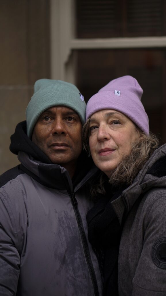 two people in warm and cozy lined toques that protect their curly hair. 