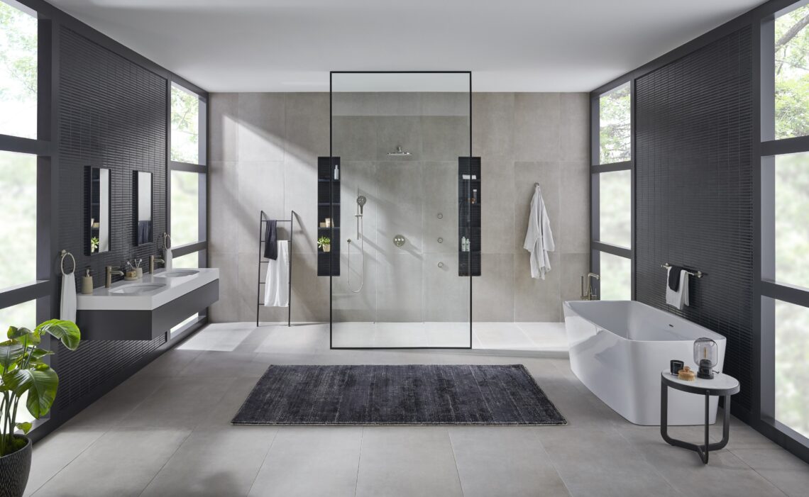 A modern bathroom with open plan shower and minimalist design features and fixtures
