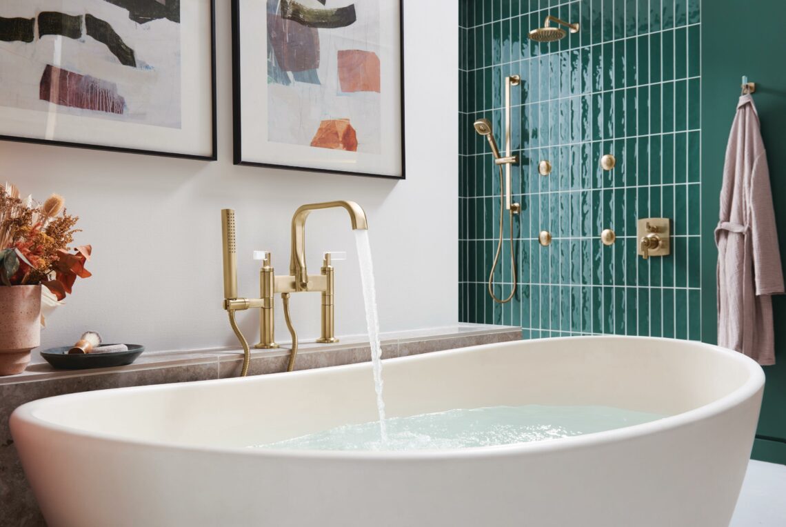 A tub filler in gold from Brizo's Allaria line in a modern bath design